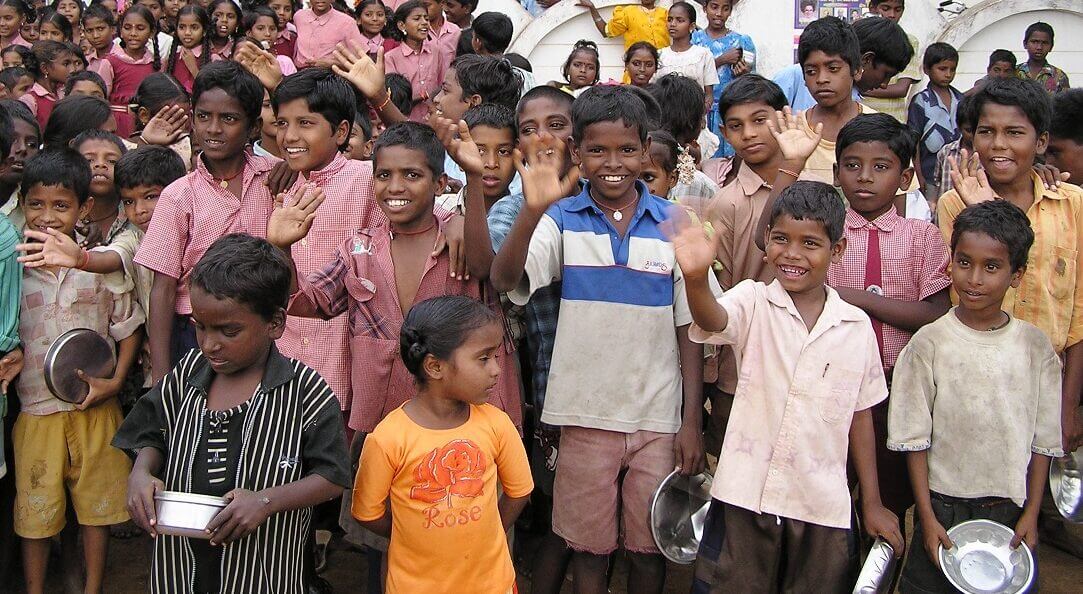 a group of children waving