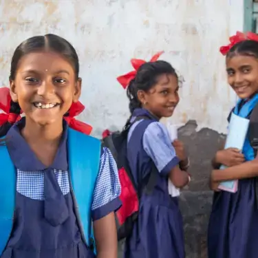 a group of childs wearing school uniforms