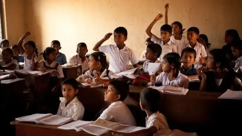 a group of children in a classroom
